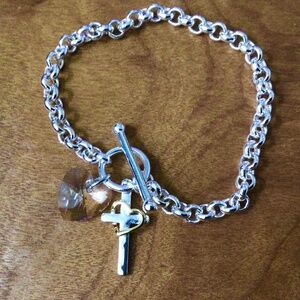 Silver tone toggle clasp bracelet with cross and crystal heart charm